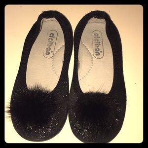 Black glitter looking shoes with fur Pom Pom